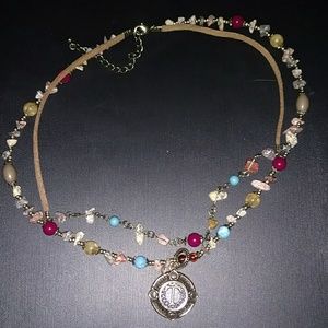 T necklace with positive precious stones